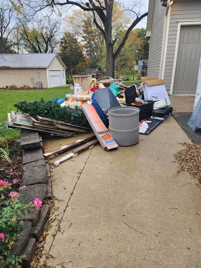 Dumpster being loaded with debris for Roofing Dumpster Rental in Swoyersville